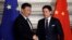 FILE - Chinese President Xi Jinping and then-Italian Prime Minister Giuseppe Conte shake hands after signing a memorandum in support of Beijing's Belt and Road Initiative, in Rome, March 23, 2019. Italy is having second thoughts about renewing the agreement next year.