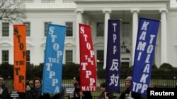 FILE - Opponents of the Trans Pacific Partnership trade agreement protest outside the White House in Washington, Feb. 3, 2016.