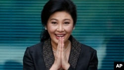 FILE - Thailand's former Prime Minister Yingluck Shinawatra arrives at the Supreme Court to make her final statements at her trial in Bangkok, Thailand, Aug. 1, 2017. She was convicted, sentenced in absentia, and is believed to be in Dubai.