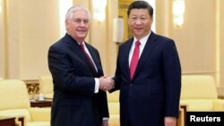 Chinese President Xi Jinping shakes hands with U.S. Secretary of State Rex Tillerson before their meeting at at the Great Hall of the People, March 19, 2017, in Beijing, China.