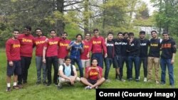 Members of Cornell University's Alpha Lambda Mu fraternity gather for an end-of-year barbecue at the college's New York campus.