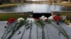 Flowers honoring the victims that died a day earlier when a gunman opened fire at an elementary school lay on a bridge in Newtown, Conn., Dec. 15, 2012. 