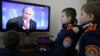 Cadets watch Russian President Vladimir Putin's annual news conference on television, Rostov-on-Don, Dec. 20, 2012.