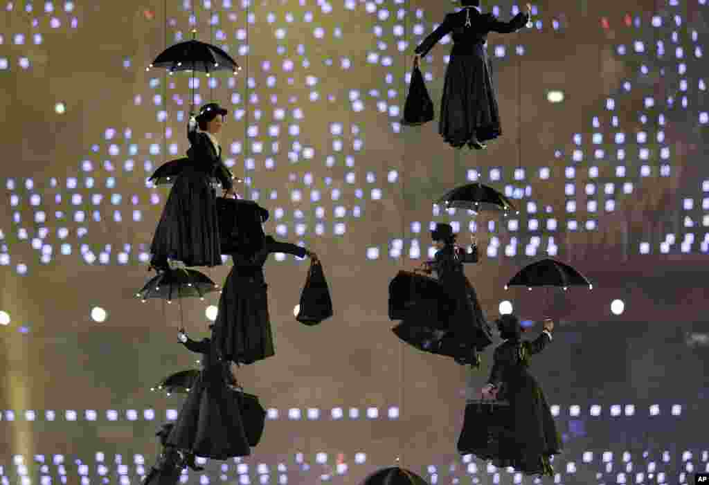Actors dressed as Mary Poppins perform during the Opening Ceremony at the 2012 Summer Olympics, July 27, 2012, in London.