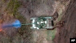 რუსეთის ტანკი ბელგოროდში, უკრაინის საზღვრის მახლობლად. ფოტო რუსეთის თავდაცვის სამინისტრომ 2024 წლის 19 მარტს გაავრცელა. 