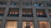 A protester gestures with five fingers, signifying the "Five demands - not one less" in a shopping mall during a protest against China's national security legislation for the city, in Hong Kong, June 1, 2020. 