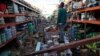 A man stands inside a supermarket destroyed by Hurricane Maria in Salinas, Puerto Rico, Sept. 29, 2017 