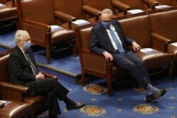 FILE - Then-Senate Majority Leader Mitch McConnell, left, and Senate Democratic Leader Chuck Schumer are seen during a joint session of Congress in the House chamber in Washington, Jan. 6, 2021.