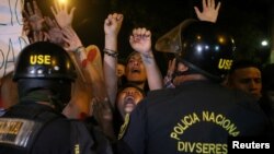 Protesters march near Centerio hospital after Peruvian President Pedro Pablo Kuczynski pardoned former President Alberto Fujimori in Lima, Dec. 25, 2017.