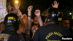 Protesters march near Centerio hospital after Peruvian President Pedro Pablo Kuczynski pardoned former President Alberto Fujimori in Lima, Dec. 25, 2017.