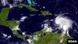 This GOES infrared and visible imagery shows storm activity in the Caribbean Sea region, Sept. 29, 2016.