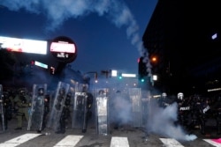 Demonstrators greet members of the National Guard as they march along Hollywood Boulevard, Tuesday, June 2, 2020, in the Hollywood section of Los Angeles.