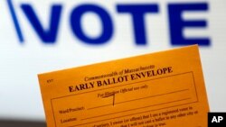 Campaign 2016 Early Voting: In this Oct. 24, 2016, photo, an early ballot envelope is held at town hall in North Andover, Mass. The millions of votes that have been cast already in the U.S. presidential election point to an advantage for Hillary Clinton i