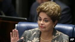 FILE - Dilma Rousseff, pictures at her impeachment trial in Brasilia, Aug. 29, 2016, contends in her appeal that opposition attorneys violated her right to due process.