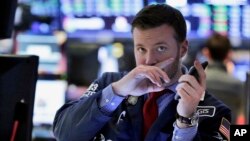 Trader Frank Masiello works on the floor of the New York Stock Exchange, Feb. 9, 2018. Stocks staged a late rally Friday, ending a wild week marked by dramatic point swings on a positive note.