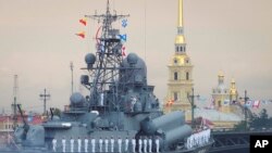 Warships float at the Neva River during the Navy Day parade in St.Petersburg, Russia, July 28, 2019. 