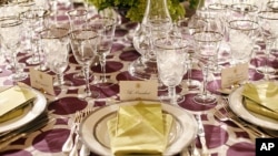 Table settings in the State Dining Room of the White House for the dinner hosted by President Obama and his wife, Michelle, for the British prime minister. (AP)