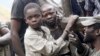 Boys take a break from panning for gold at the Marco gold mine in Mukungwe locality, Congo, May 9, 2014.