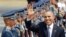 President Barack Obama waves to the media upon arrival Monday at the Ninoy Aquino International Airport in Manila, Philippines, April 28, 2014.