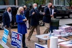 Democratic presidential candidate former Vice President Joe Biden arrives to speak with supporters outside a voter service center, in Chester, Pennsylvania, Oct. 26, 2020.