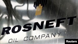 FILE - A logo of Russian state oil firm Rosneft is seen at its office in Moscow, Oct. 18, 2012. 