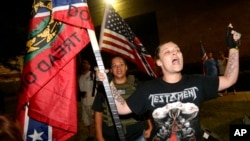 People against the removal of confederate era statues demonstrate across the street from the Jefferson Davis statue, in anticipation of its imminent removal in New Orleans, May 11, 2017. 