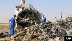 Russian emergency services personnel working at the crash site of a A321 Russian airliner in Wadi al-Zolomat, a mountainous area of Egypt's Sinai Peninsula. (Russian Emergency Ministry Handout photo)