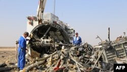 Russian emergency services personnel working at the crash site of a A321 Russian airliner in Wadi al-Zolomat, a mountainous area of Egypt's Sinai Peninsula. (Russian Emergency Ministry Handout photo)