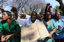 FILE - Zimbabwean medical staff march in Harare, Sept. 19, 2019.