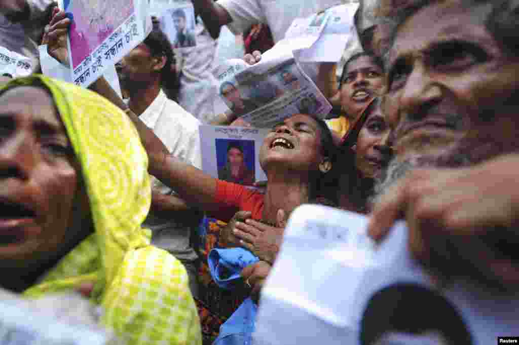Relatives mourn as they look for garment workers, missing after the collapse of the Rana Plaza building in Savar, Bangladesh, May 2, 2013. 
