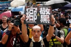 People demonstrate outside the police station during a protest against the Yuen Long attacks in Yuen Long, New Territories, Hong Kong, July 27, 2019.
