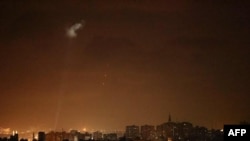 Shootings from the Palestinian territory light-up the night sky in Gaza city, on July 3, 2021, in response to the bombing of Israeli planes on Gaza military targets. - Israel attacked Gaza military targets late July 3, 2021, the army and Palestinian…