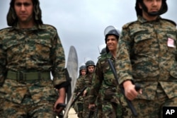 A group of Iranian paramilitary Basij forces, affiliated with the Revolutionary Guard, attend training at a base in northeastern Tehran on April 24, 2015. (Ebrahim Norooz/APi)