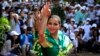 Cambodian dancers perform during a celebration of International Human Rights Day in Phnom Penh, Cambodia, Tuesday, Dec. 10, 2013. Thousands of activists, monks and villagers, as well as opposition party supporters led by Cambodian opposition leader Sam Rainsy, joined rallies Tuesday calling of an end to injustice in the capital. (AP Photo/Heng Sinith)