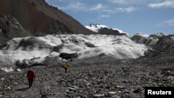 Glaciers in China's bleak, rugged Qilian mountains are disappearing at a shocking rate as global warming brings unpredictable change and raises the prospect of crippling, long-term water shortages, scientists say. (REUTERS/Carlos Garcia Rawlins)