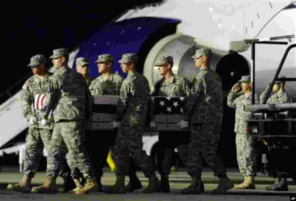 An Army carry team moves a transfer case containing the remains of Pvt. Danny Chen Wednesday, Oct. 5, 2011 at Dover Air Force Base, Delaware. (AP Photo)