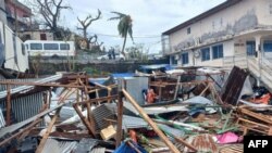 This photograph shows a pile of debris of metal sheets and wood after the cyclone Chido hit France's Indian Ocean territory of Mayotte, on Dec. 14, 2024 in the capital Mamoudzou.