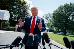FILE - President Donald Trump talks to reporters on the South Lawn of the White House before departing for his Bedminster, N.J. golf club, July 5, 2019, in Washington.