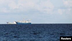 FILE - Chinese vessels are pictured in disputed South China Sea, April 21, 2017.