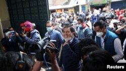 Ecuador's presidential candidate Andres Arauz smiles as he arrives with his running mate Carlos Rabascall at a polling station during the second round of presidential election, in Quito, Ecuador, Apr. 11, 2021. 