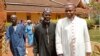 FILE - Archbishop of Bangui Dieudonne Nzapalainga (R) walks with imam Oumar Kobine Layama (2nd R), representative of the local Muslim community, in Bangui Feb. 10, 2014.