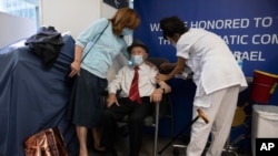 Yehuda Widawsky, a 102-year-old Holocaust survivor, receives a third Pfizer-BioNTech COVID-19 vaccine at a hospital in Tel Aviv, Israel, Aug. 1, 2021.