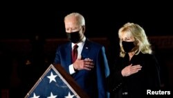 President Joe Biden and first lady Jill Biden pay their respects to late Capitol Police Officer Brian Sicknick, who died on Jan. 7 from injuries he sustained while protecting the U.S. Capitol during the Jan. 6 attack on the building, as he lies in honor.