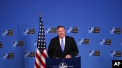 U.S. Secretary of State Mike Pompeo talks to journalists during a news conference during a NATO Foreign Ministers meeting at the NATO headquarters in Brussels, Wednesday, Nov. 20, 2019.