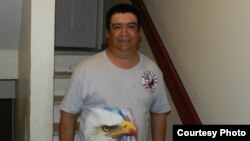 Guillermo Peralta, shown standing at the entrance to his Pennsylvania apartment building, has had his deportation proceedings overturned by an immigration court judge. (Photo courtesy of Mike Kornely)