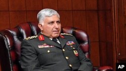 General Necdet Ozel, the commander of the paramilitary police, meets with Turkey's President Abdullah Gul (unseen) at the Presidential Palace of Cankaya in Ankara, July 29, 2011