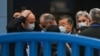FILE - Members of the World Health Organization team investigating the origins of the COVID-19 coronavirus visit the closed Huanan Seafood Market in Wuhan, China, Jan. 31, 2021. 