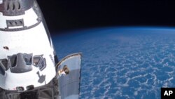 The Space Shuttle Endeavour is docked to the International Space Station during its final mission to space.