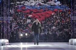 Russian President Vladimir Putin attends a concert marking the seventh anniversary of Russia's annexation of Crimea at Luzhniki Stadium in Moscow, Russia on March 18, 2021.