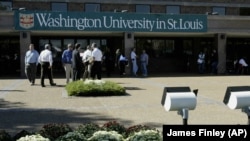 Students walk outside the Francis Field House at Washington University in St. Louis, Missouri.